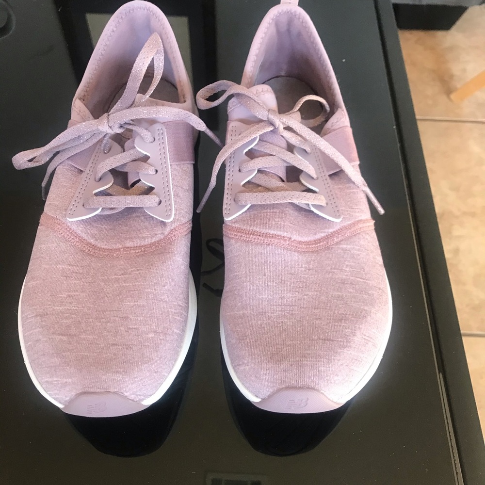 New balance lilac sneakers.  Worn once, too big.